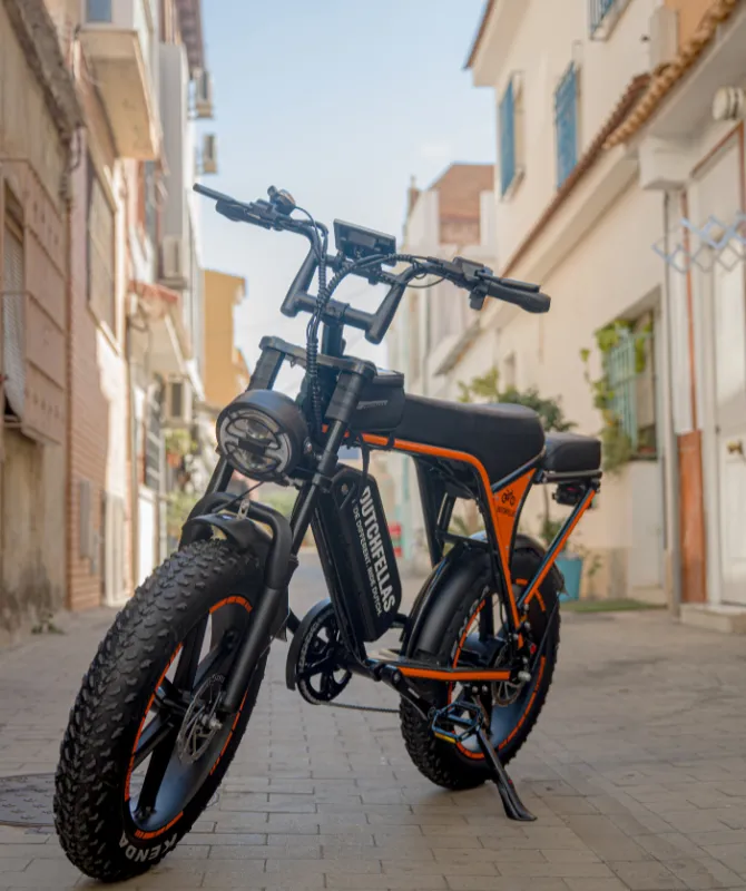 A DutchFellas bike parked in a Málaga old-town street