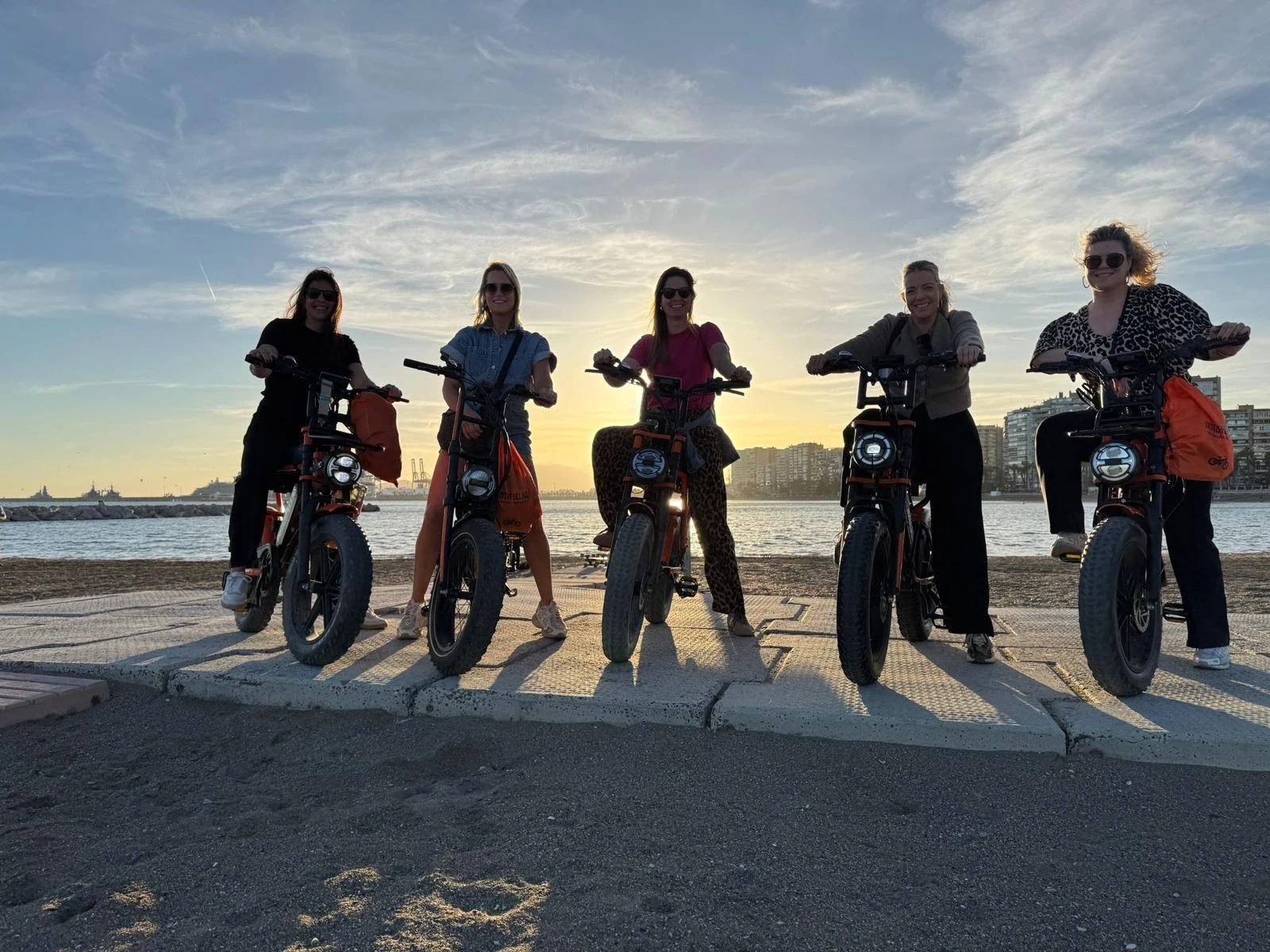 Riders on a DutchFellas tour at sunset in Málaga